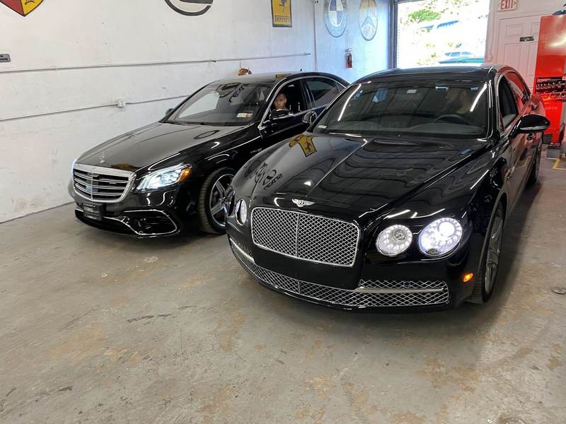 Bentley Flying Spur and Mercedes S-Class in a collision repair bay at Gold Coast Collision Center